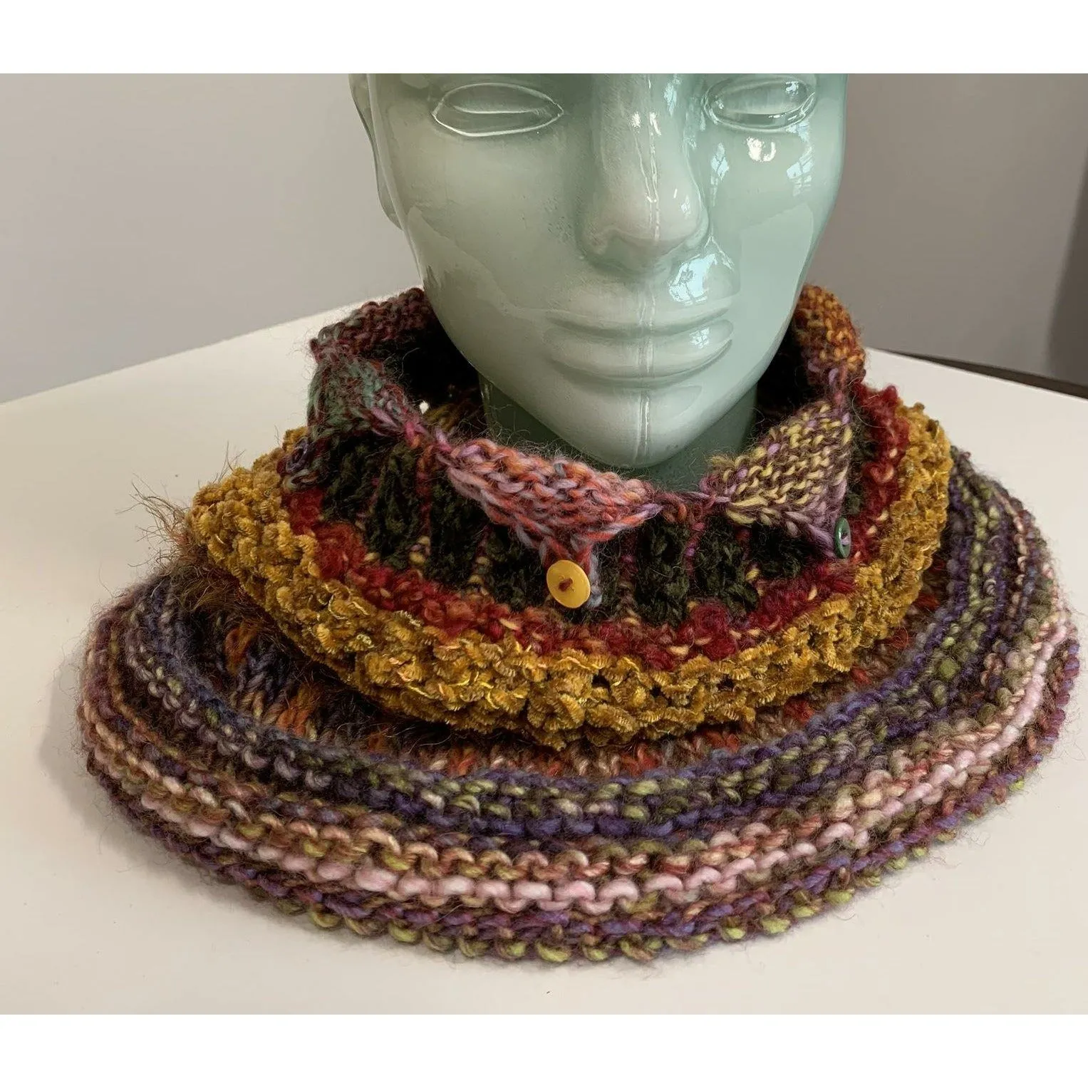 Handknit circular neck scarves in many colors and knit stitches to lend lots of textures and warmth