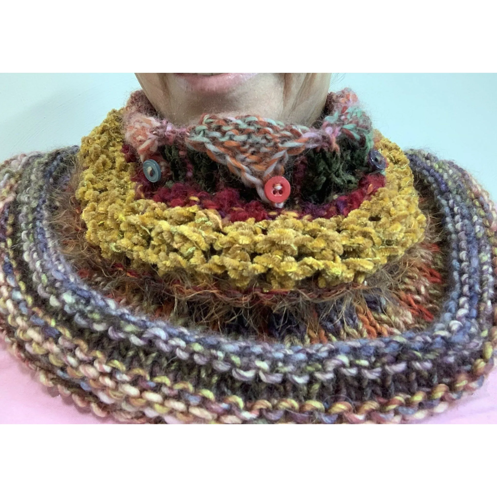 Handknit circular neck scarves in many colors and knit stitches to lend lots of textures and warmth