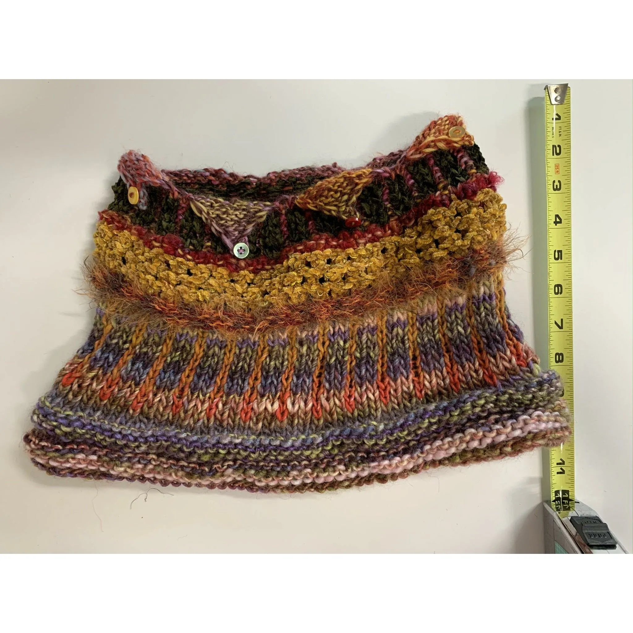 Handknit circular neck scarves in many colors and knit stitches to lend lots of textures and warmth