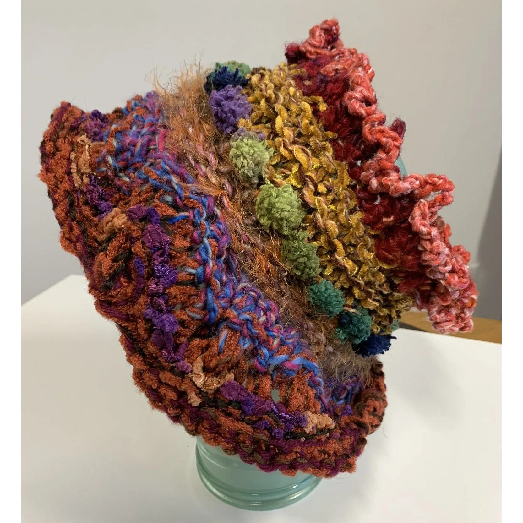 Handknit circular neck scarves in many colors and knit stitches to lend lots of textures and warmth